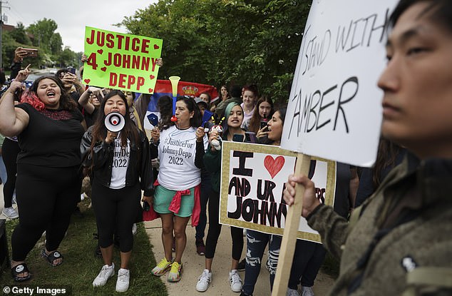 Supporters of Johnny Depp argue with a supporter of Amber Heard outside a Fairfax County courthouse, May 27, 2022