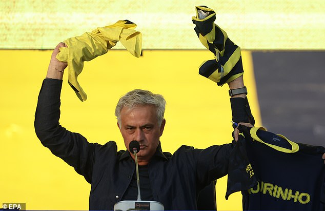 Mourinho held up the Fenerbahce shirt and declared: 'This shirt is now my skin'