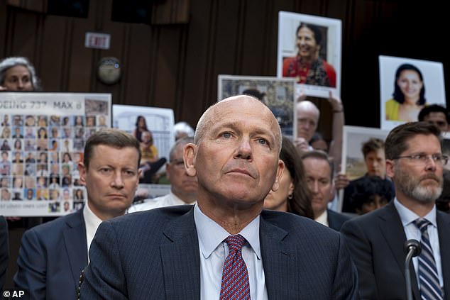 With protesters in the audience, Boeing CEO Dave Calhoun testifies before the Senate Committee on Homeland Security and Governmental Affairs at the Capitol in Washington last month.