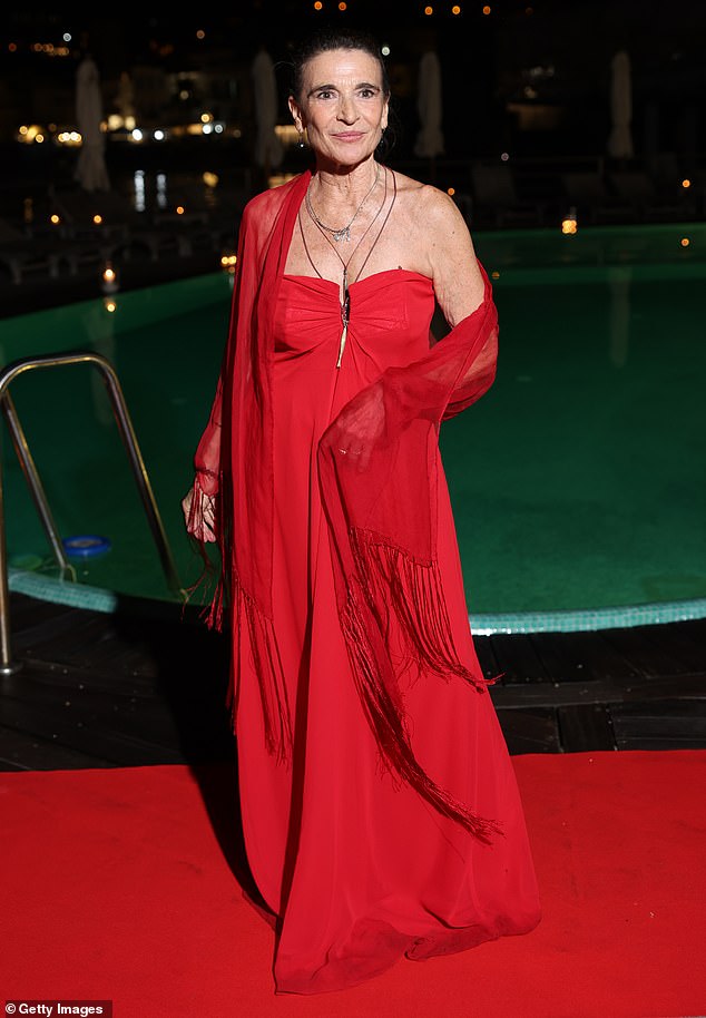 Italian actress Lina Sastri, 70, also exuded glamour as she hit the red carpet in a strapless red dress