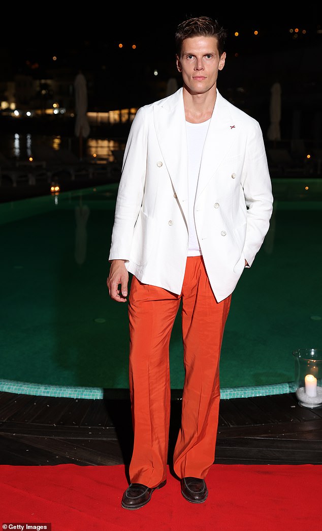 Meanwhile, Italian model Alessandro Egger, 32, looked fierce in a white jacket and orange pants