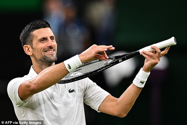 Novak Djokovic pretends to play violin for his daughter as he celebrates victory over Denmark's Holger Rune