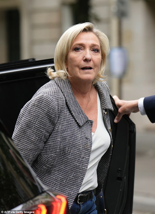 Marine Le Pen arrives at the headquarters of the far-right RN party in Paris yesterday, a day after the second round of France's legislative elections. The French president was due to begin efforts on Monday to liberate France from its worst political uncertainty in decades, after the left defeated the far-right in elections in which no group won an outright majority.