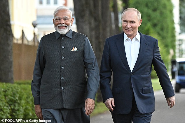 Russian President Vladimir Putin and Indian Prime Minister Narendra Modi take a walk during yesterday's meeting