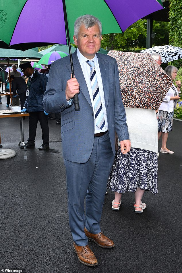 Adrian Chiles wore a blue-gray suit with a tonal blue tie