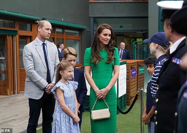 July 16, 2023 -- Prince William, Kate, Prince George and Princess Charlotte speak to ball boys and girls at the All England Club ahead of the Wimbledon Championships