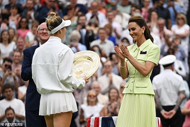 July 15, 2023 -- Czech Republic's Marketa Vondrousova receives the trophy from the Princess of Wales after winning her women's singles final over Tunisia's Ons Jabeur