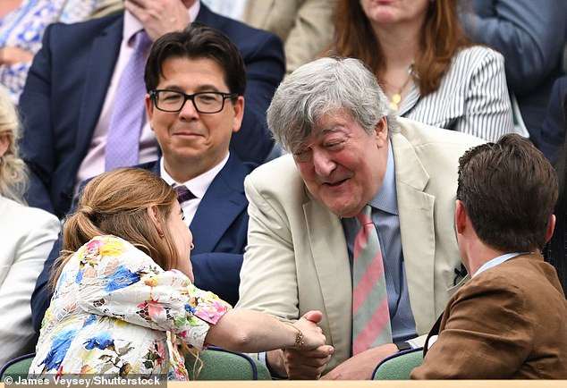 Sitting behind Beatrice, Stephen leaned forward eagerly to take the royal woman's hand lovingly as they greeted each other