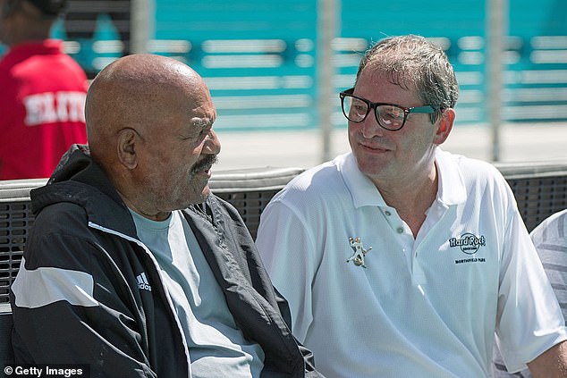 The signal-caller ended his NFL career with a stint with the Dolphins. Pictured with Hall of Fame running back Jim Brown at a Miami game in 2016