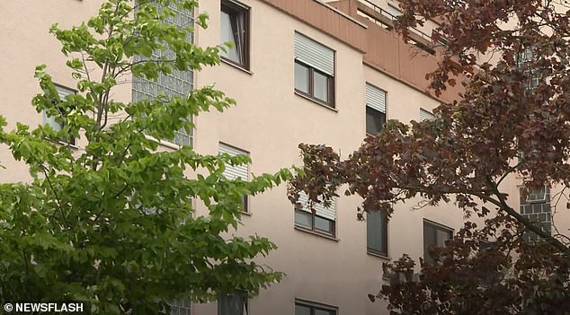 The newborn was thrown 12 feet out of an apartment window onto the asphalt below (photo shows a general view of the apartment building)