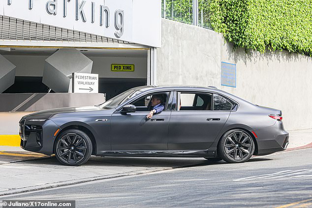 Affleck drove into the parking lot in his sleek vehicle