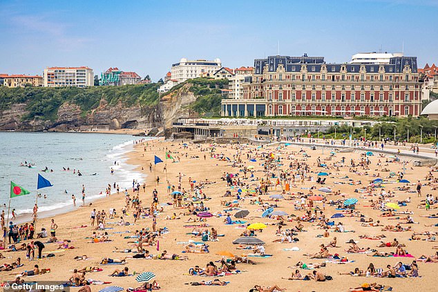 Grande Plage beach with Hotel du Palais in the background. Winston Churchill, Pablo Picasso and Charlie Chaplin all stayed here