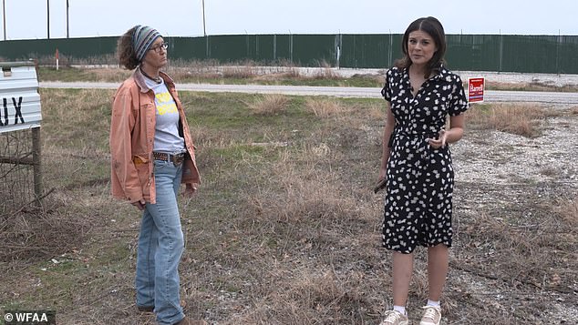 In the photo above, a local resident is seen with a news reporter as the two discuss the sound, which has been compared to that of a jet engine.