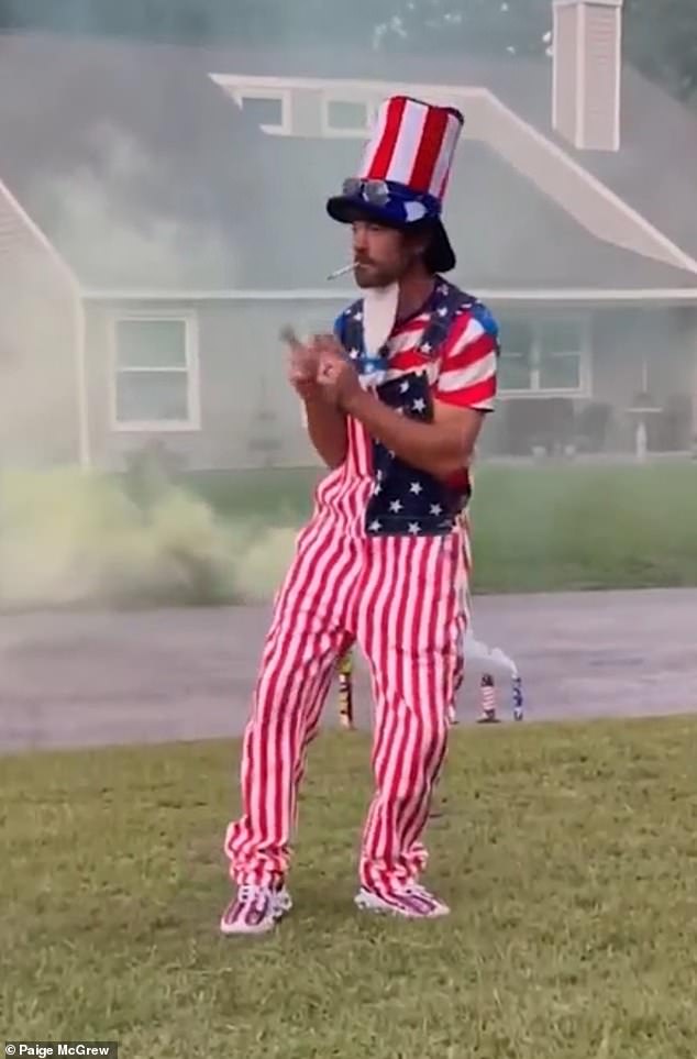 Dressed in a parotid-style attire, complete with a top hat adorned with the flag's signature stars and stripes, he placed the fireworks on his head while doing a little dance in an attempt to 