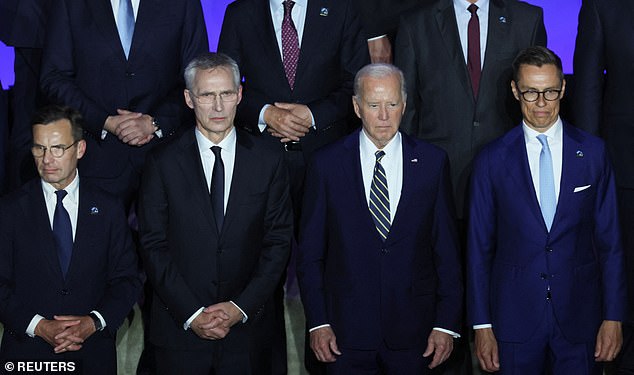 US President Joe Biden (center), NATO Secretary General Jens Stoltenberg (left) and Finnish President Alexander Stubb (right) pose for a photo on NATO's 75th anniversary.