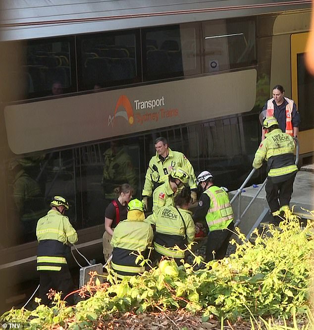 Emergency workers are seen transporting Ms Nguyen to hospital after she was hit