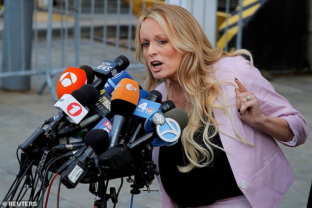 Adult film actress Stephanie Clifford, also known as Stormy Daniels, speaks as she leaves the federal courthouse in Manhattan in New York City on April 16, 2018