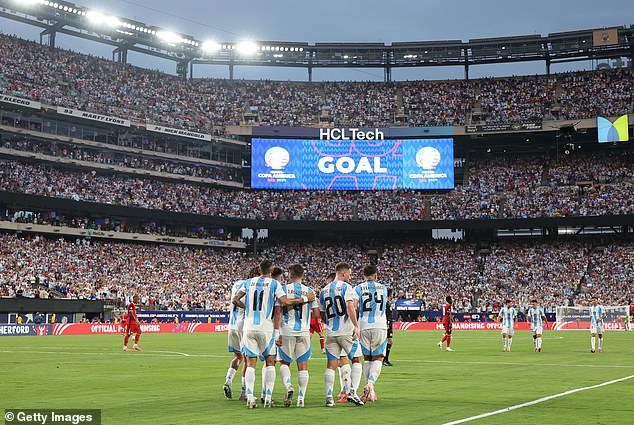 The Argentine players celebrate with Alvarez and thousands of Argentine fans at MetLife