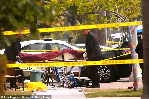 A stabbing victim is taken away as officers investigate the crime scene at the corner of 16th Street and Pecan Avenue in Huntington Beach