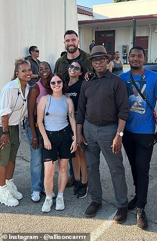 Kelce (back) poses with Grotesquerie crew and cast members after returning from Europe