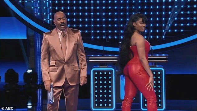 The 29-year-old Grammy-winning 'Savage' rapper insisted she get on the board and proudly twirled around while showing off her curves in a strapless red leather bustier and leather pants