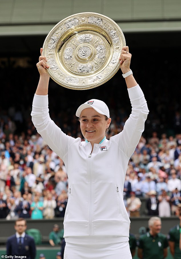 Clijsters hopes the return to Wimbledon will 'trigger' Barty (pictured winning the women's title in 2021)