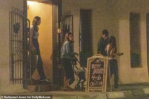 Hilaria leaves the restaurant after enjoying some of the best Italian food in New Mexico