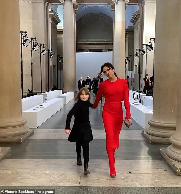 An old photo showed Victoria and Harper at one of her first fashion shows, wearing red and black outfits