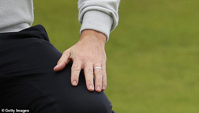 McIlroy was spotted playing with his wedding ring during his reconciliation with wife Erica Stoll