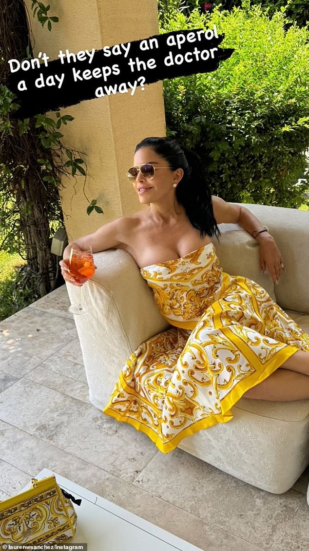 Sanchez sipped an Aperol spritz while wearing a Dolce & Gabbana dress in a new photo shared to social media last week