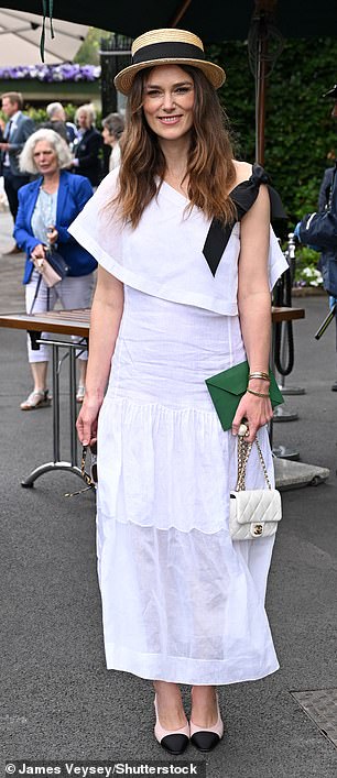 The actress, 39, looked typically chic in a semi-sheer white dress, paired with pink loafers and a straw hat