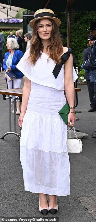 She accessorised with stylish sunglasses and carried her belongings in a small cream and gold handbag.