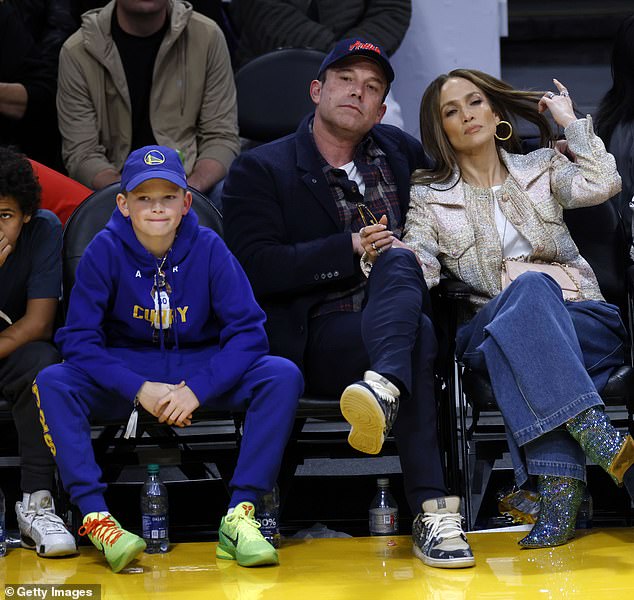 Lopez and Affleck and his son Samuel at a basketball game between the Los Angeles Lakers and Golden State Warriors at the Crypto.com Arena in LA in March