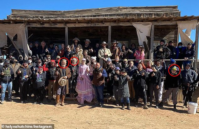 Baldwin, Hutchins and gunsmith Gutierrez-Reed are surrounded on the set of Rust, along with other cast members and crew