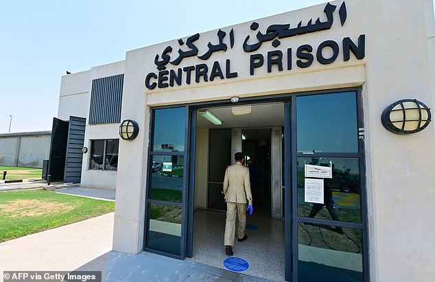 A police officer enters Al-Awir Central Prison in Dubai, United Arab Emirates