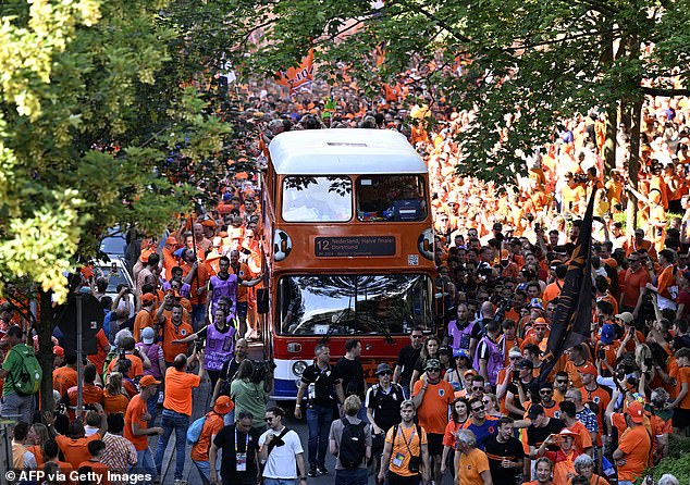 Dutch supporters cheer on the streets outside the stadium in Dortmund ahead of the semi-final