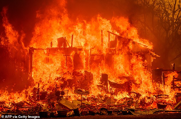 Flames destroyed a home during the Thompson Fire in Oroville, California on July 2, 2024