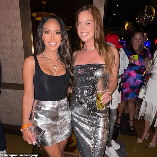 The reality star posed next to the comedian, who also opted for a metallic silver look and silver jewelry