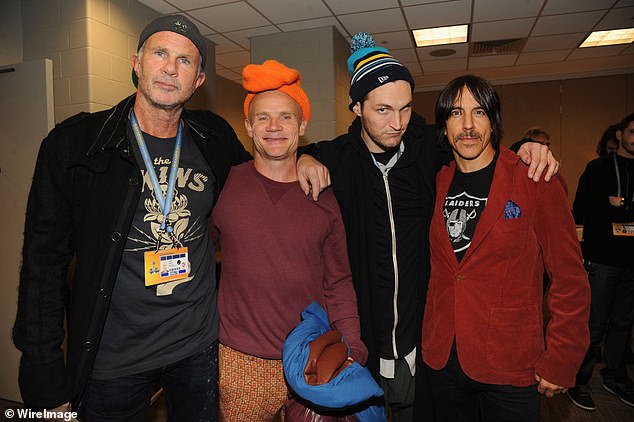 Klinghoffer is pictured with Red Hot Chili Peppers members Chad Smith, Flea and Anthony Kiedis in 2014