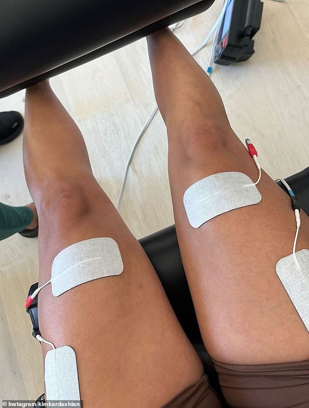 The SKIMS founder uploaded both clips and photos showing her using a form of muscle stimulation on her thighs