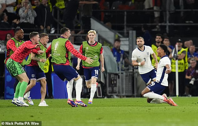 The England substitutes ran onto the pitch to celebrate with the goalscorer