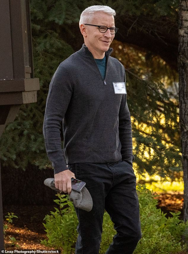 Anderson Cooper laughs as he visits 'summer camp for billionaires'