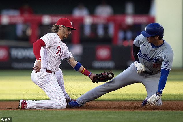 After stealing second base, Ohtani shook the dirt off his left batting glove