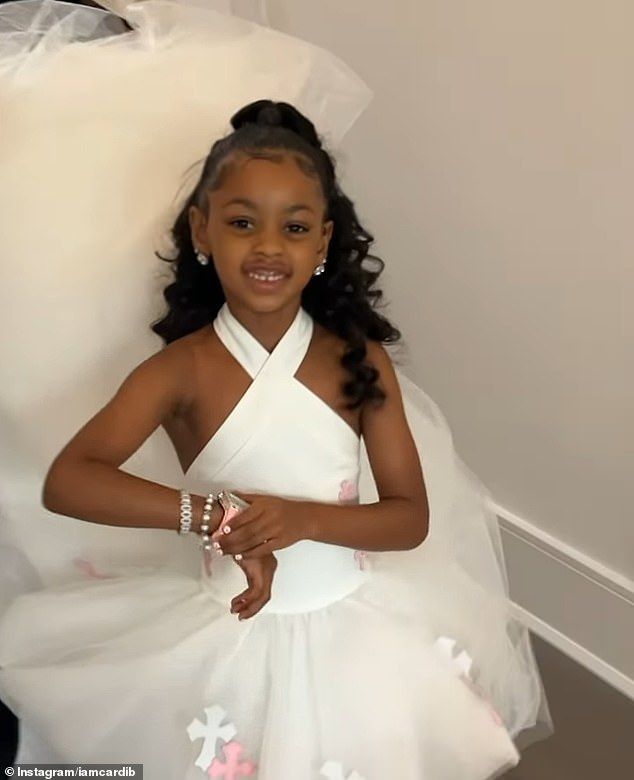 Birthday girl Kulture was all dressed up for her special day, wearing a white custom-made dress