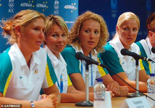 Robbins (far right) during a press conference in the wake of the national scandal