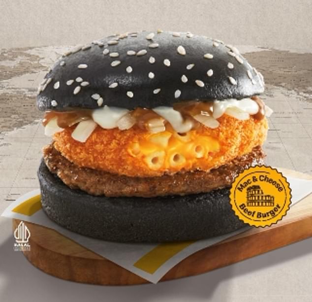 The Mac and Cheese Beef burger, not available in Australia, features a slice of breaded macaroni and cheese on an Australian beef patty, spread with a stroganoff sauce on a bun with black sesame seeds