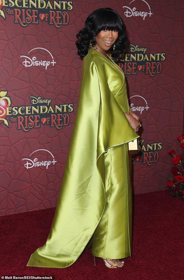 The 45-year-old singer wore a striking lime green satin sheath-like dress for the star-studded event