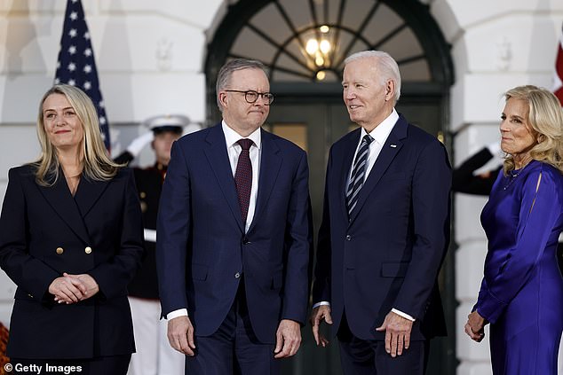 Anthony Albanese and his partner Jodie Haydon are pictured on the left with US President Joe Biden and his wife Jill