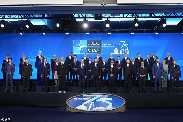 NATO leaders pose for a family photo as the summit began yesterday