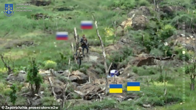 Graphic drone footage appears to clearly show grotesque war crimes carried out by a Russian regiment known for past atrocities. Pictured: Two Ukrainian troops in Robotyne in Ukraine's Zaporizhzhia region